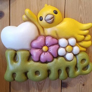 Formella grande con scritta "Home" e uccellino giallo